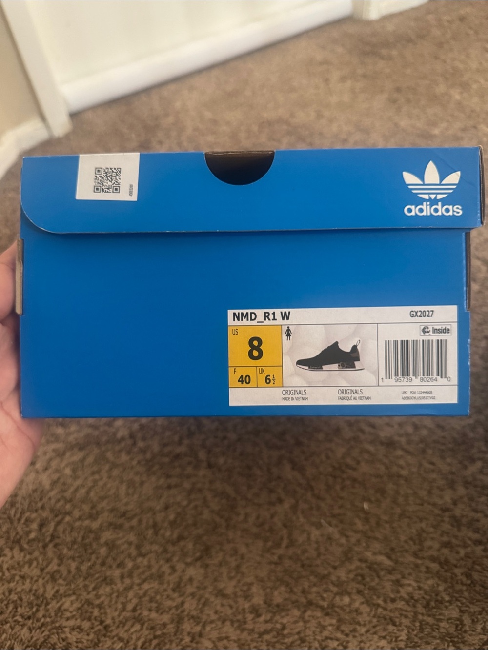 Adidas women’s NMD R1 black and leopard
